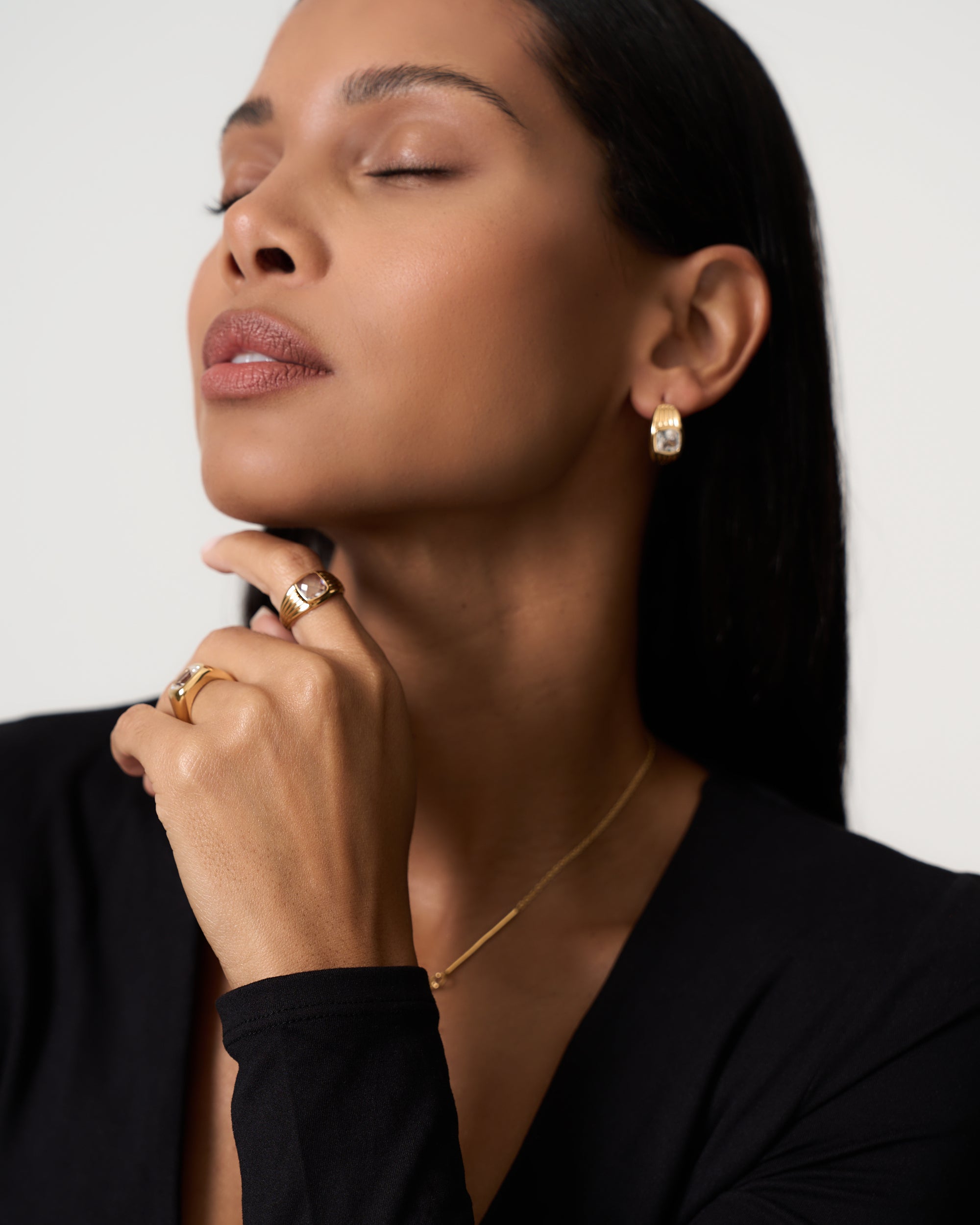 Model wears 18k gold vermeil textured ring with white sapphire